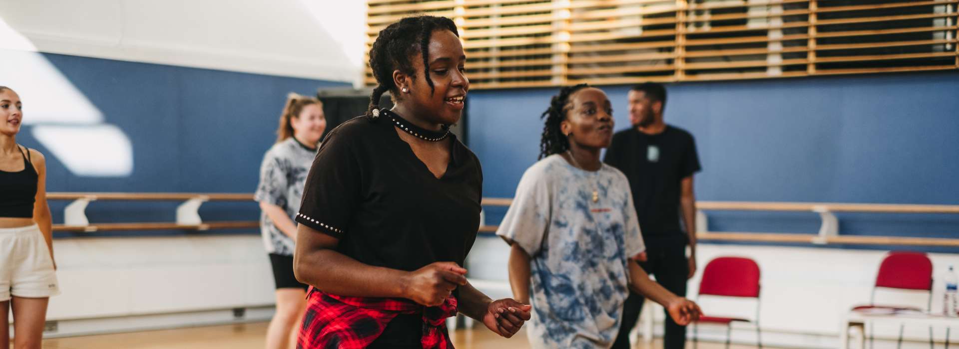 Five young people from Young Company, rehearsing for an upcoming show. 