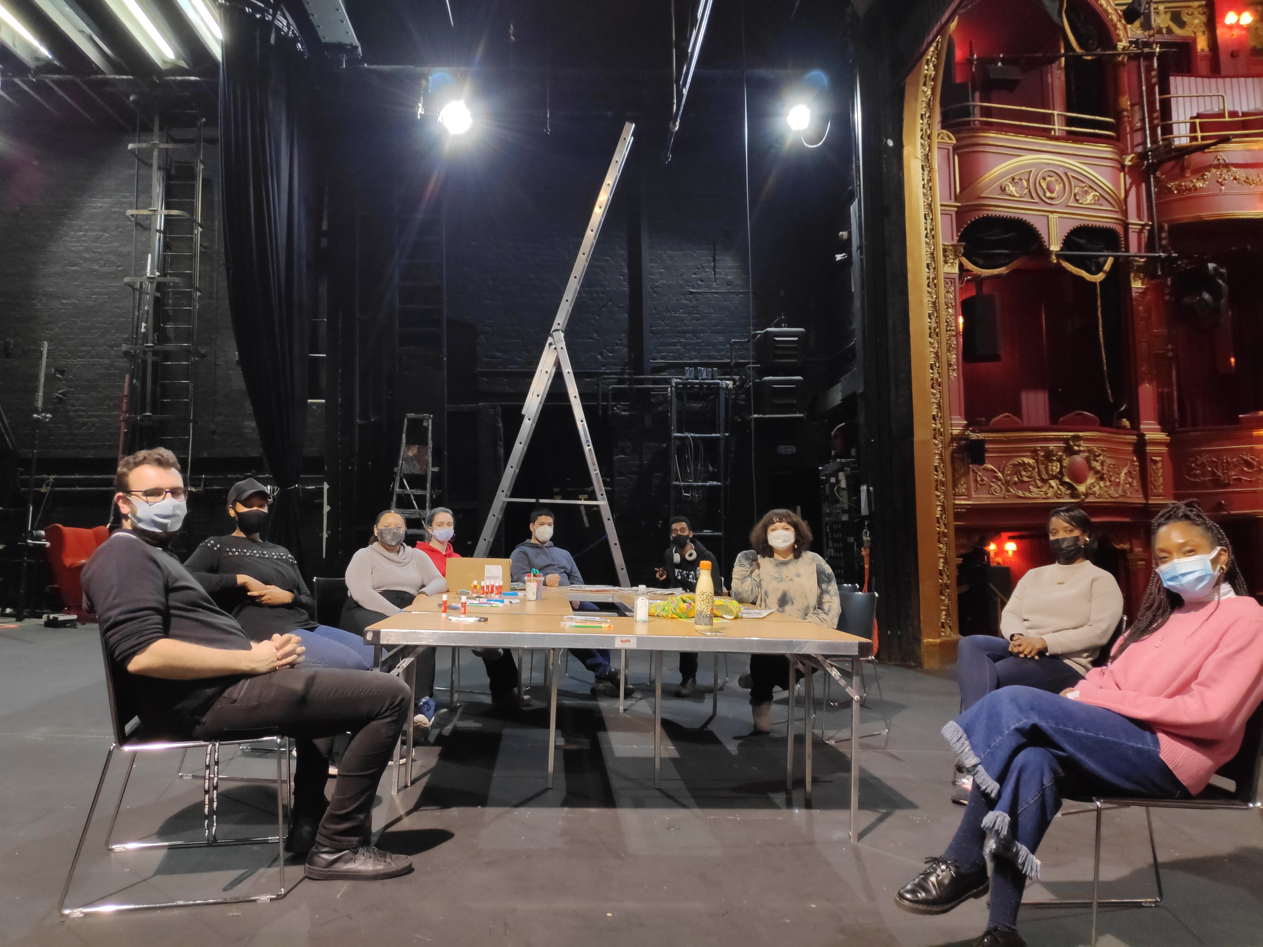 Group photo of Young Technicians with Nadia Fall on the Stratford East stage